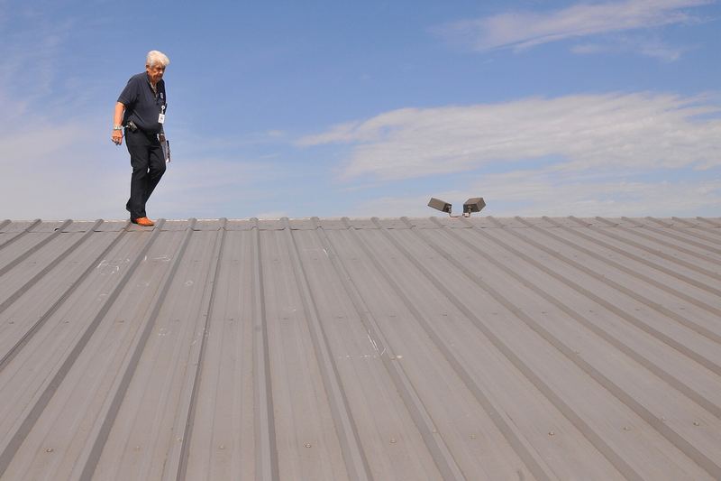 Inspection of a hail-damaged roof